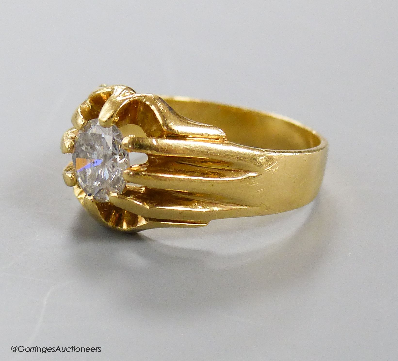 A modern 18ct gold and claw set solitaire diamond ring, size T, gross weight 9.2 grams